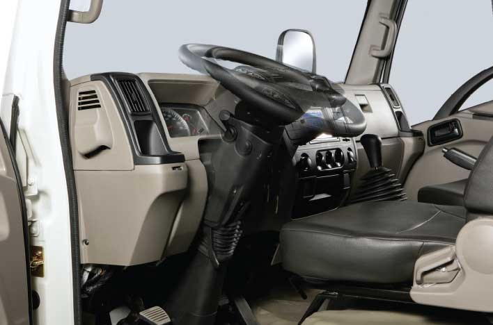 Daewoo dump truck with adjustable tilt steering wheel and audio controls