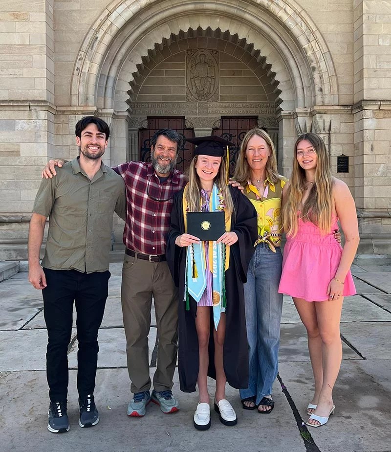 Annika Piccaro, center, proudly holds her diploma from Colorado College in Colorado Springs, with her family at her side. The true achievement was not just earning the diploma, but walking across the stage to receive it after a traumatic snowmobile accident a year earlier nearly took her life. Photo courtesy of Annika Piccaro. 