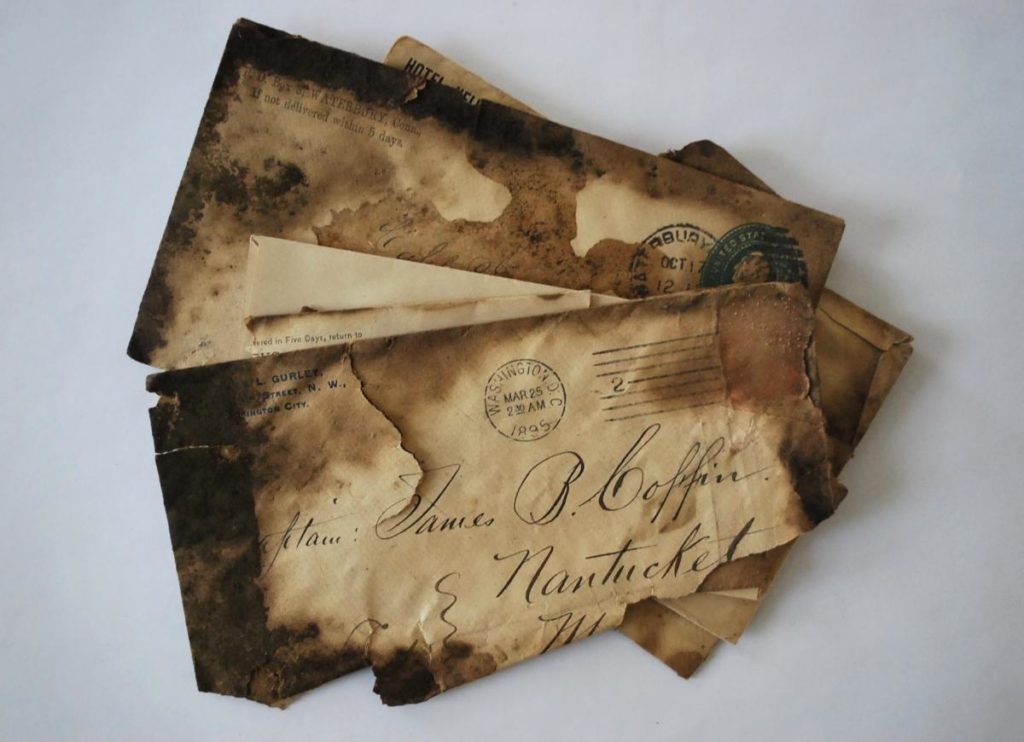 Charred letters, addressed to Captain James B. Coffin, hidden on the chimney